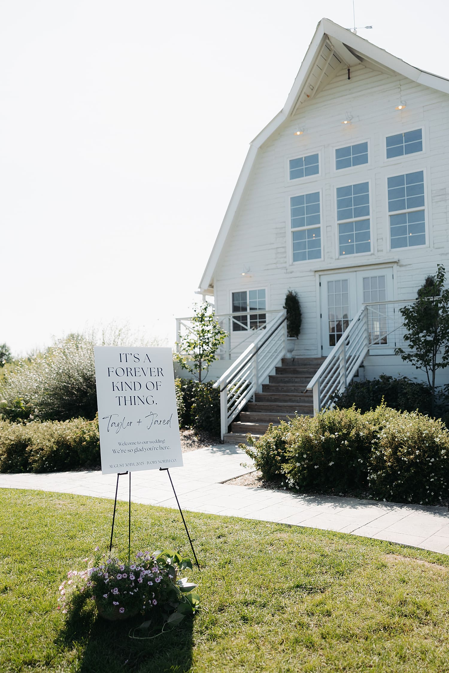 large white sign on lawn outside of venue by Wisconsin wedding photographer
