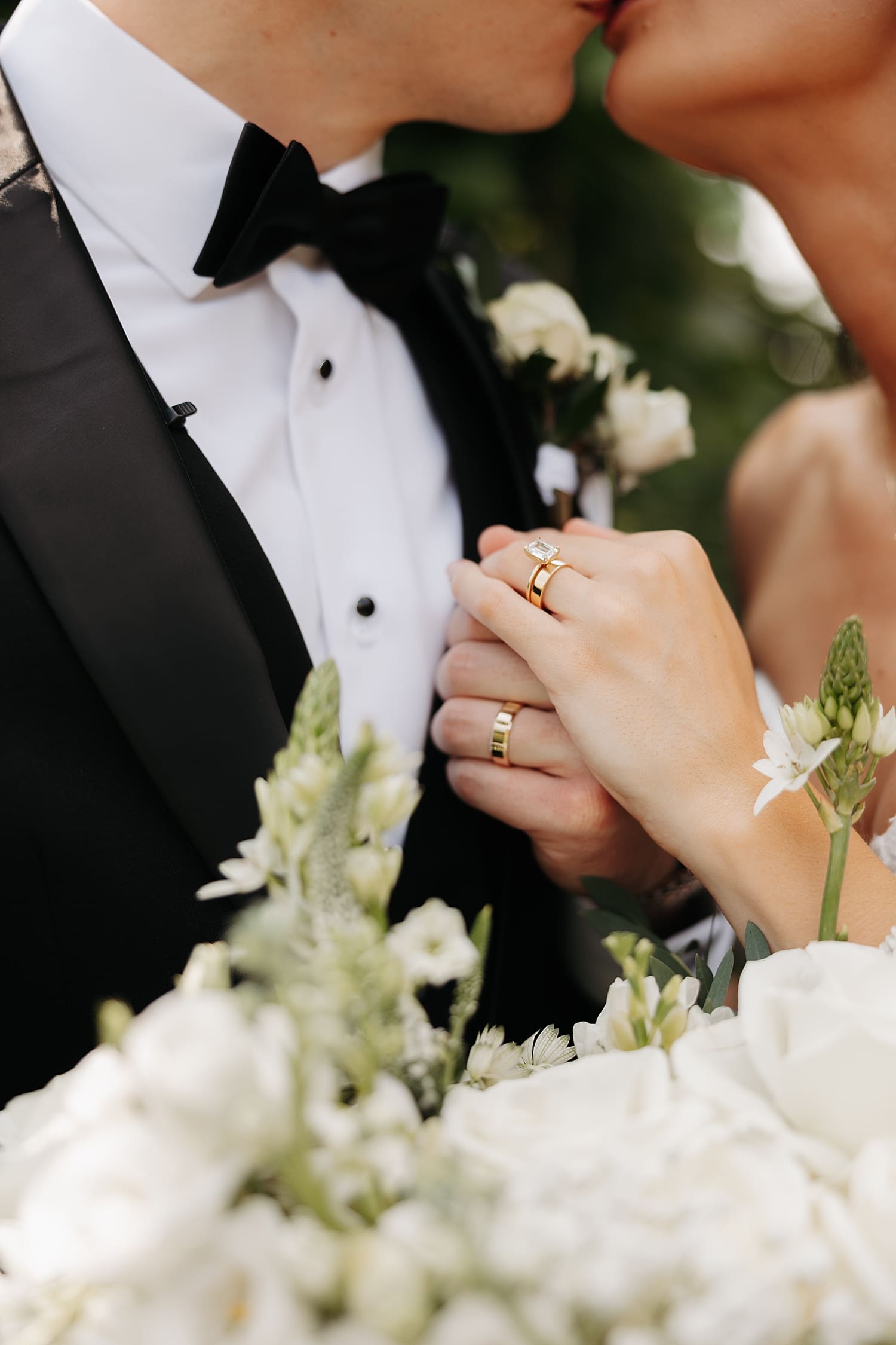 couple show off their new gold rings during Summer garden party