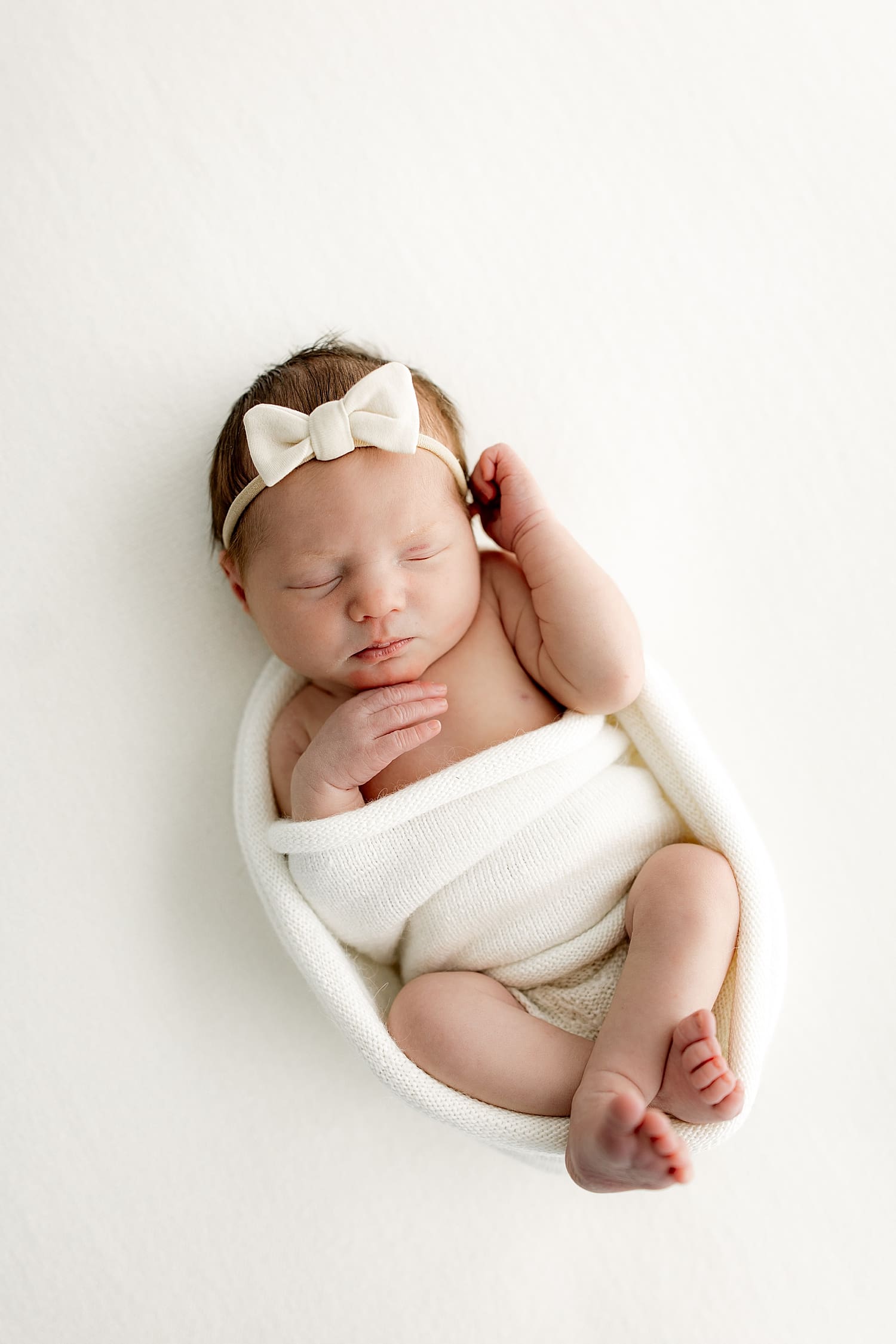 new little one in white bow by Rose and Oak Photography