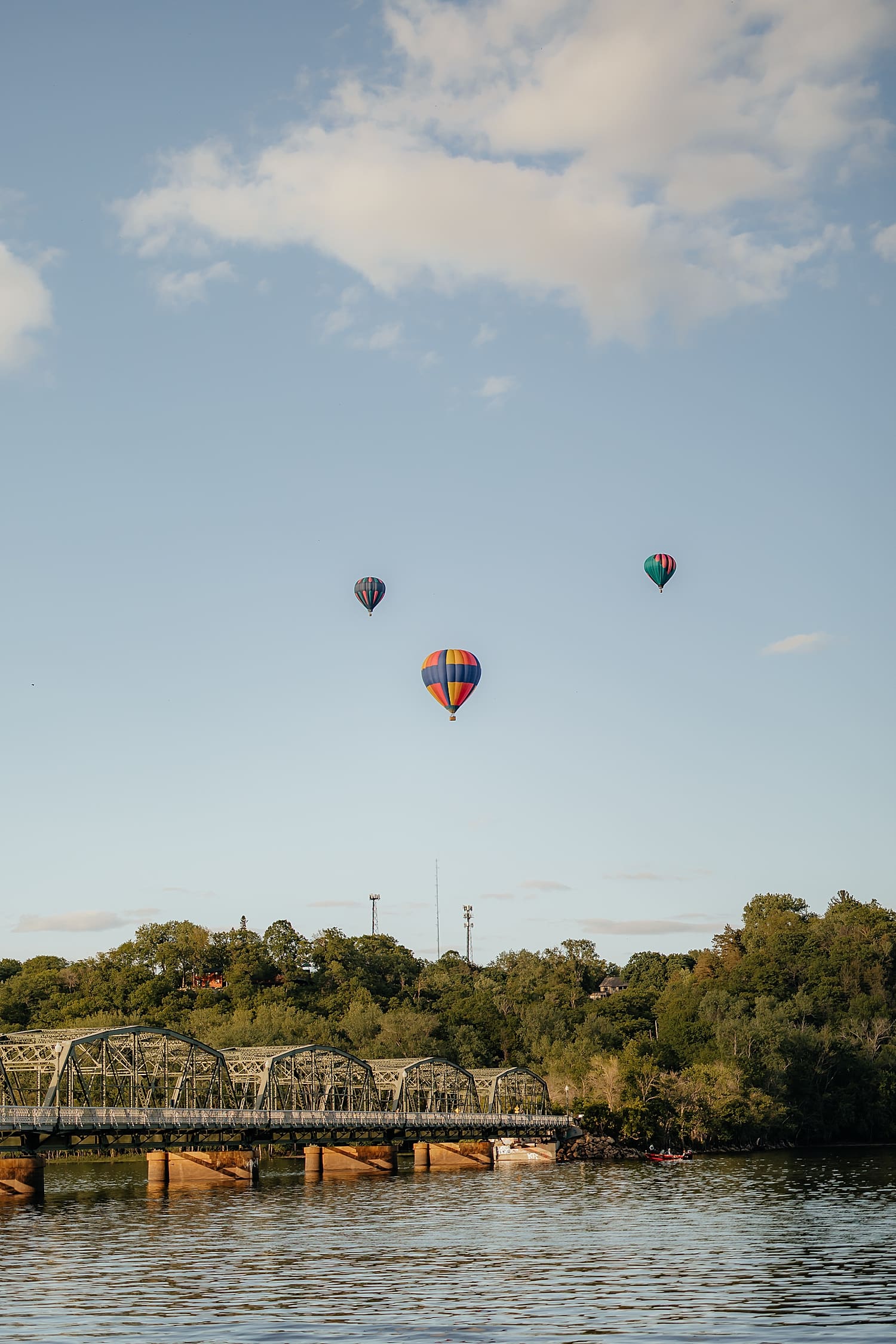 hot air balloons float over river for waterfront proposal