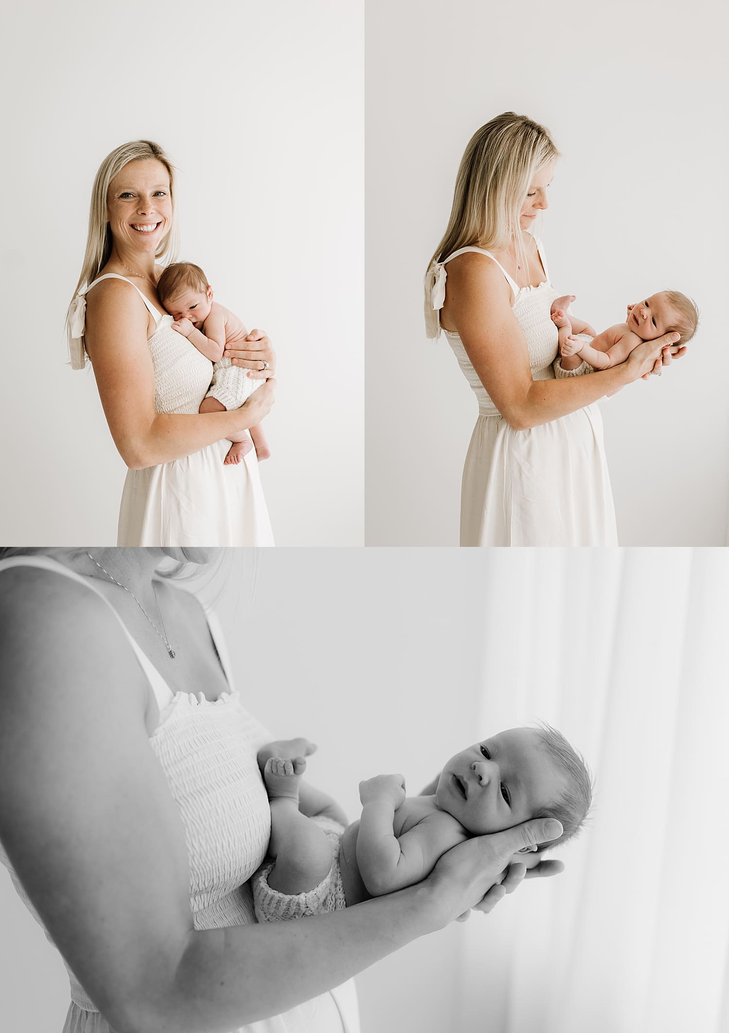 blonde in white dress holds baby out in arms next to window by Wisconsin family photographer