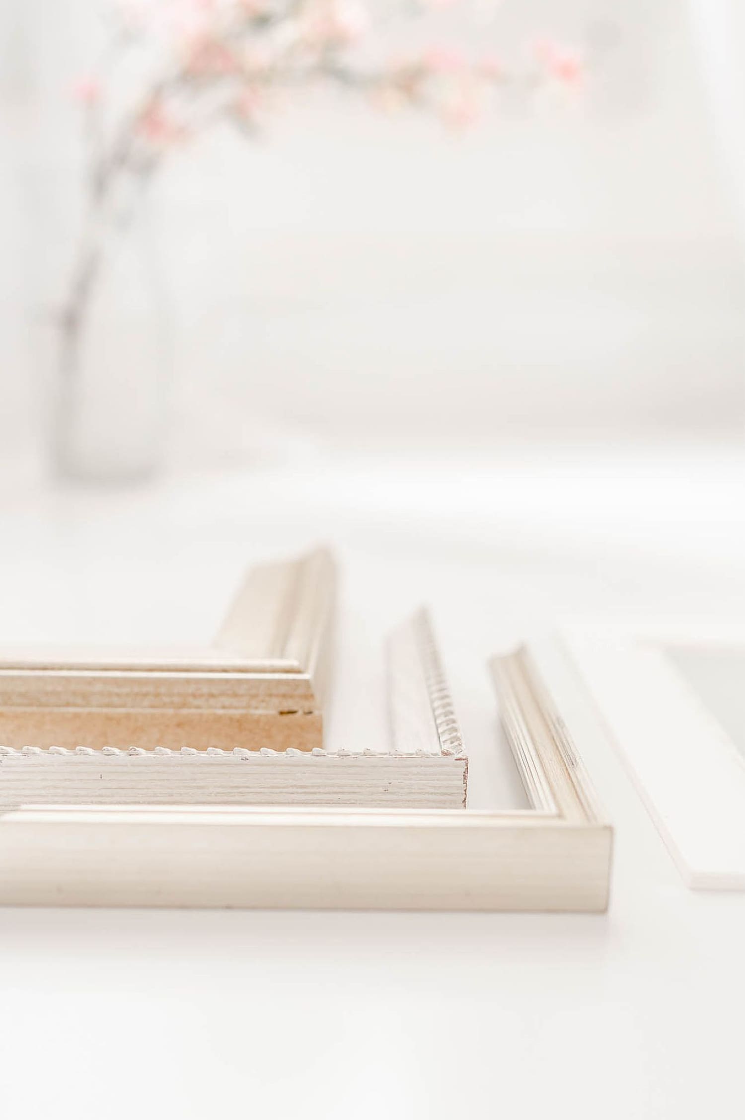 three light wooden frames stacked together by Wisconsin family photographer